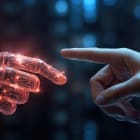 The human finger delicately touches the finger of a robot&rsquo;s metallic finger. Concept of harmonious coexistence of humans and AI technology,