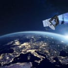 Telecommunication satellite providing global internet network and high speed data communication above Europe. Satellite in space, low Earth orbit. Worldwide communication technology.