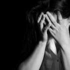 Young depressed woman, domestic and rape violence,beaten and raped sitting in the corner