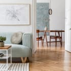 Stylish scandinavian living room with design mint sofa, furnitur