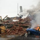 Ukraine war, air strike, on city, urban warfare, street and hous