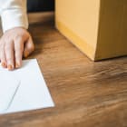 Business woman sending resignation letter and packing Stuff Resi