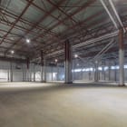 Modern design of a large empty warehouse. Warehouse premises with final finishing. .Metal bearing structures.
